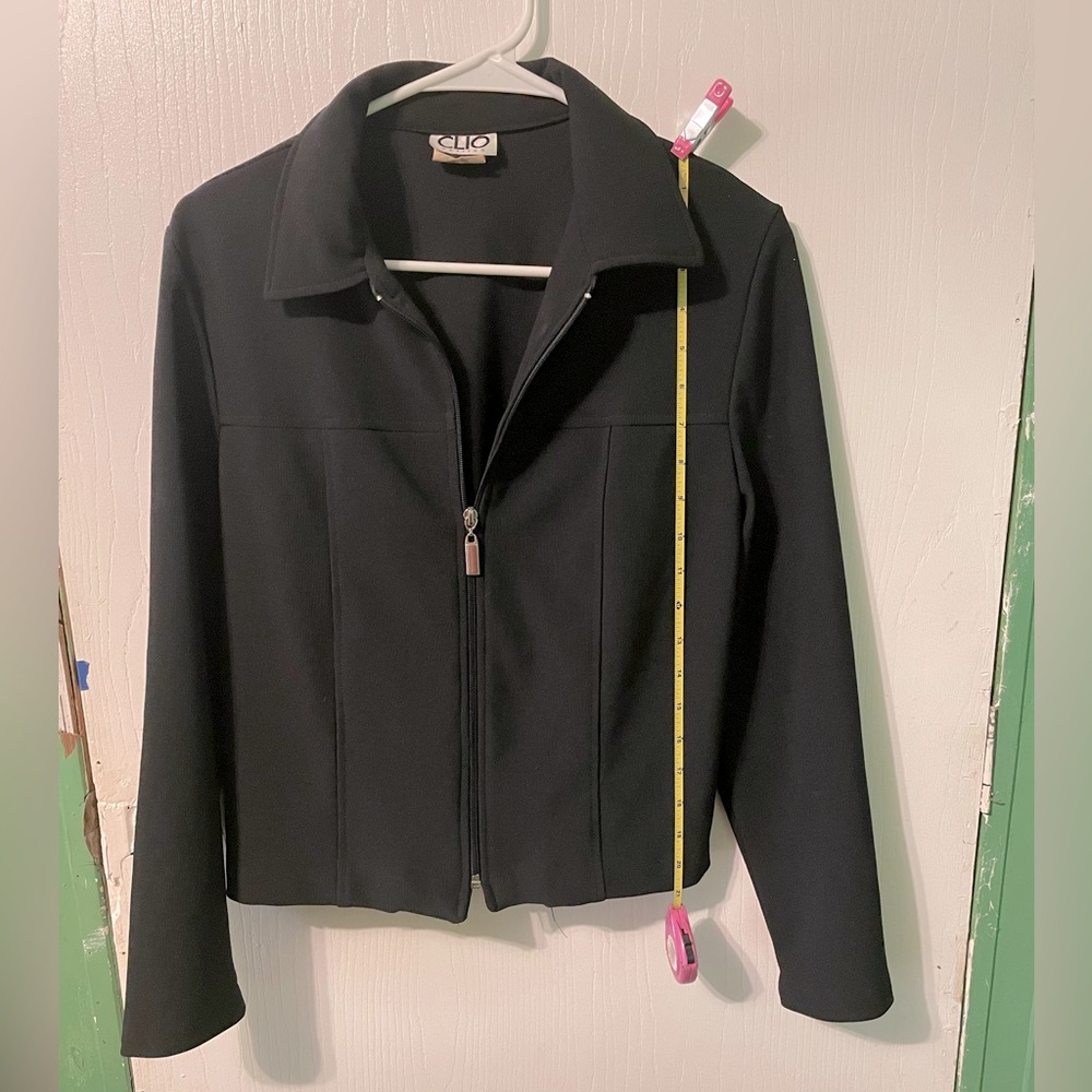 Black 94 percent polyester 6 percent spandex.
